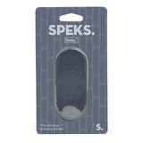 Speks Slabs S silicone sensory sticker in its original retail packaging, featuring a dark gray oval-shaped sticker visible through a clear plastic window on a dark gray patterned backing card.