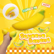Squeeze banana toy with a hand holding it, on a bright yellow background with 'Squeeze Me' text.