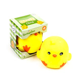 Yellow Squeezies Springtime Chick squeeze toy sitting beside its green gingham box packaging