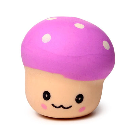 Pink Squeezies Mushroom stress toy with a smiling face and cream polka dots