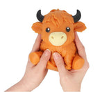 Squeezy Highland Cow orange squishy stress fidget toy held in two hands