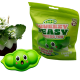 Green stress toy with packaging labeled 'Squeezy Peasy' on a white background.