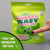 Finger pressing through the try-me window on the front of the Squeezy Peasy packaging bag