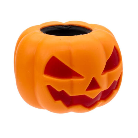 An orange jack-o'-lantern-shaped silicone bead with carved facial features and a black center hole, shown on a plain white background.