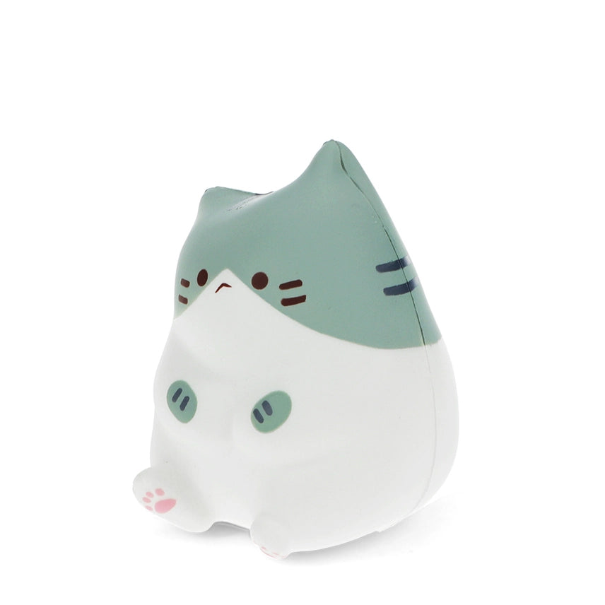 Angled side view of a green and white kawaii sitting cat squishy toy showing chubby rounded body