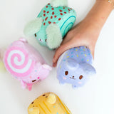 Squish Berries Sugar Squish scented squishy plush four characters held in hand