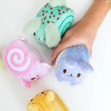 Squish Berries Sugar Squish scented squishy plush four characters held in hand