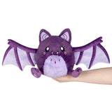 Squishable Mini Spooky Bat purple plush wings open held in hand