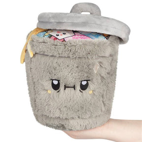 Squishable Mini Trash Can grey plush with open lid and colourful trash interior, held in hand
