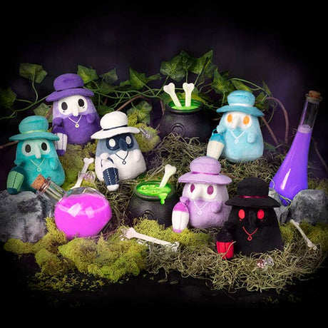 Set of colorful Halloween-themed figurines with a dark background