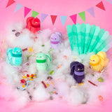 Colorful plush toys on a pink background with cotton candy and flags