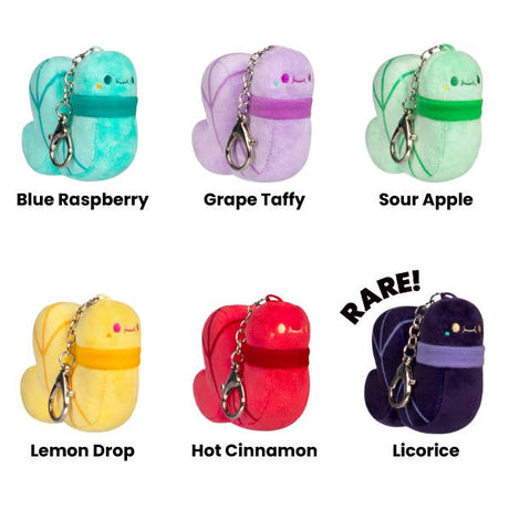 Six colorful keychains labeled with flavors on a white background