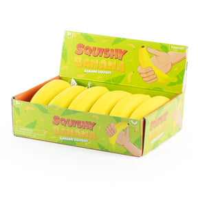 Display box of yellow squishy banana fidget toys by Keycraft, shown filled with stock
