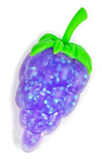 Close-up of purple glitter gel grape bunch squishy fidget toy with green stem and leaf