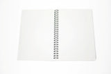 Sticker Hoard reusable sticker book open flat showing blank glossy pages and spiral binding