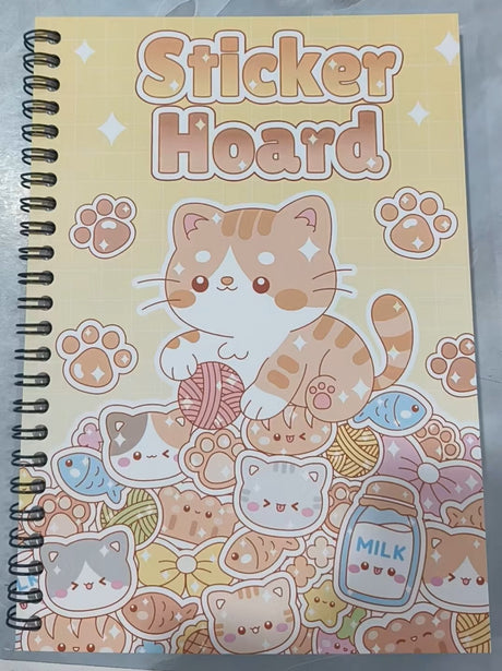 Kawaii Sticker Hoard spiral book with tabby cat and yarn ball cover design on yellow background