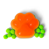 Orange and green squishy paw print with scattered neon green pom poms