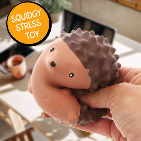 Close-up of the Stress Hog kawaii hedgehog squishy being held in one hand indoors