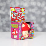 Kawaii red mushroom squishy stress toy sitting in its colourful psychedelic Stress Shroom gift box