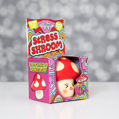 Kawaii red mushroom squishy stress toy sitting in its colourful psychedelic Stress Shroom gift box