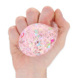 Stretch N Squeeze Confetti Ball pink glitter sequin stress fidget ball held in hand
