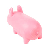 Pink Stretchies Pig squishy toy shown at an angle highlighting its rounded sand-filled body