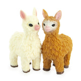 Cute stretchy bean-filled llama toys in white and brown shown together front view, realistic fluffy texture detail on white background