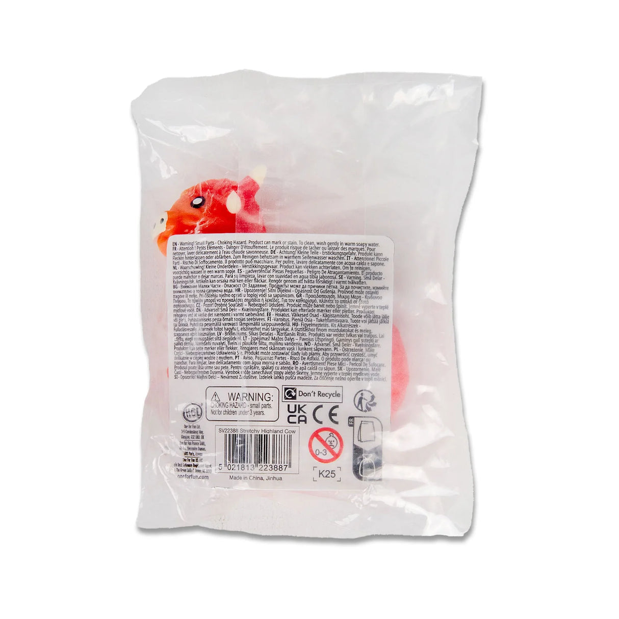 Reverse of stretchy highland cow packaging showing multilingual safety information and choking hazard warning