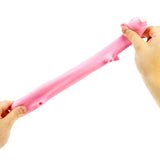 Two hands pulling a pink stretchy pig stress toy to its full elongated length