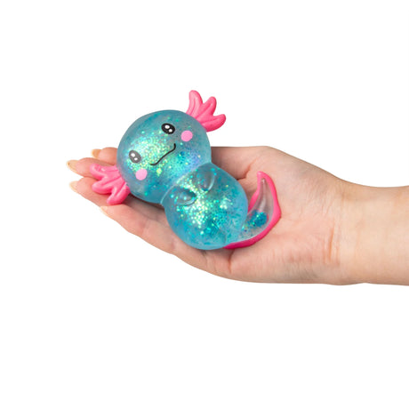Blue large glitter gel Sugar Axolotl squishy resting in an open palm showing teal iridescent glitter