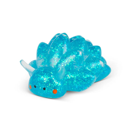 Close-up of blue glitter Sugar Sea Sheep squishy fidget toy showing iridescent sparkle detail