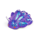 Close-up of purple glitter Sugar Sea Sheep squishy fidget toy showing iridescent sparkle detail