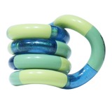 Green and teal Tangle Classic fidget toy coiled into its resting spiral shape with glitter segment detail