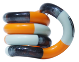 Orange and grey Tangle Classic fidget toy coiled into its resting spiral shape