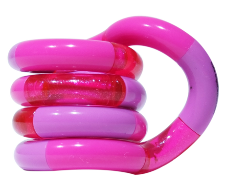 Pink and lilac Tangle Classic fidget toy coiled into its resting spiral shape with glitter segment detail