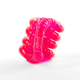 Pink glow-in-the-dark Tangle Jr. fidget toy with ribbed textured segments, coiled into a stack