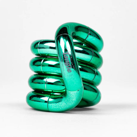 Green metallic Tangle Jr. fidget toy coiled into its resting spiral shape showing chrome finish
