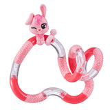 Pink and red bunny Tangle Jr. Pet fidget toy laid out in a flowing freeform shape