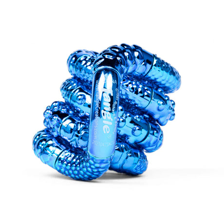 Blue textured metallic Tangle Jr. fidget toy coiled into its resting spiral shape showing ridged chrome surface
