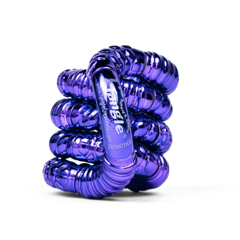 Purple textured metallic Tangle Jr. fidget toy coiled showing ridged chrome finish detail