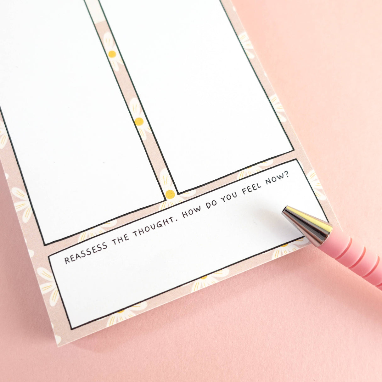 Close-up of thoughts vs facts notepad reassess prompt section, floral daisy border
