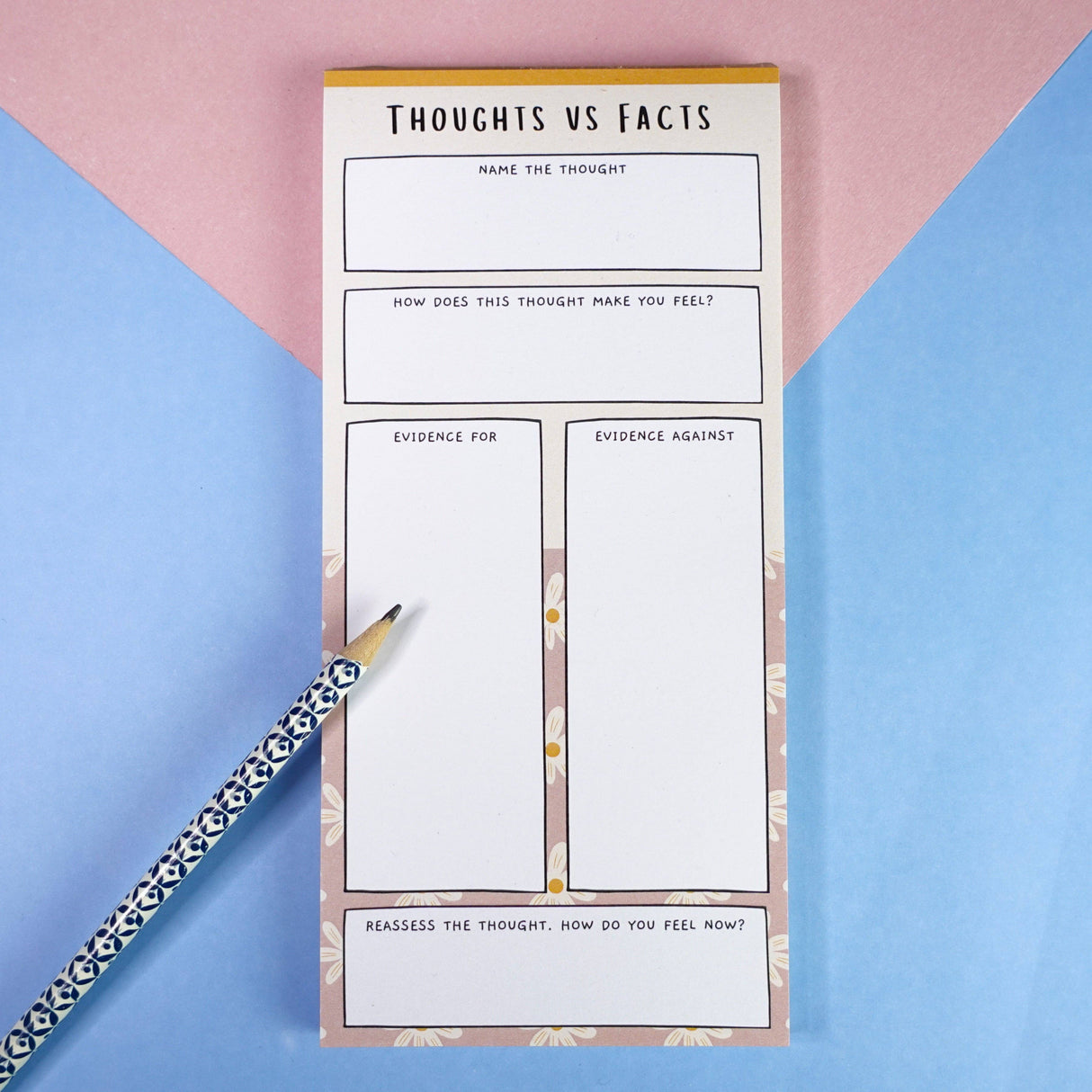 Thoughts vs Facts anxiety notepad full view, floral border, pink and blue background