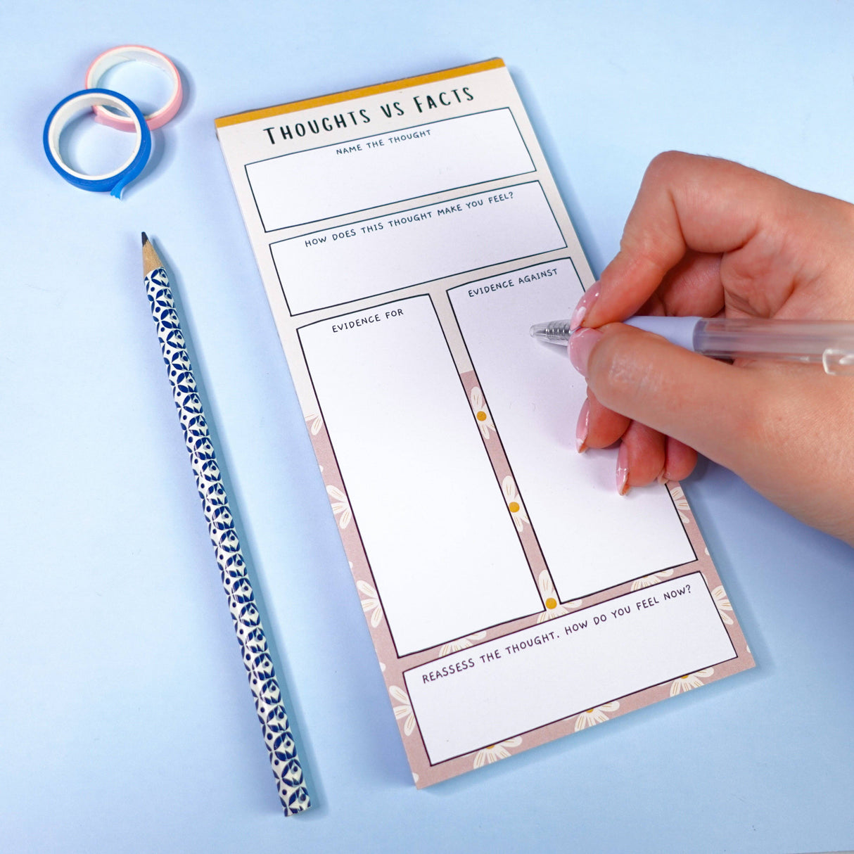 Thoughts vs Facts CBT notepad being written in, anxiety and mental health stationery