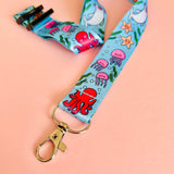 Lanyard with ocean-themed design featuring jellyfish and octopuses on a pink background