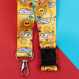 Lanyard with cartoon sun and cloud design on a red and blue background